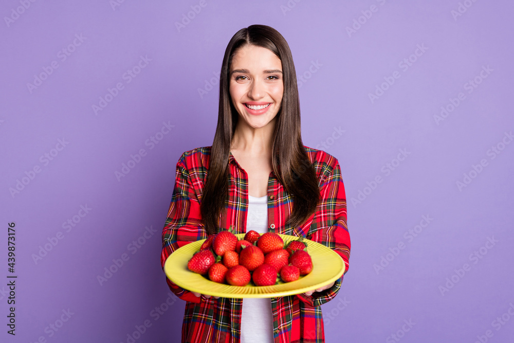 Photo of lovely brunette hairdo millennial lady give fruits wear red shirt isolated on purple color background Photo of lovely brunette hairdo millennial lady give fruits wear red shirt isolated on purple color background