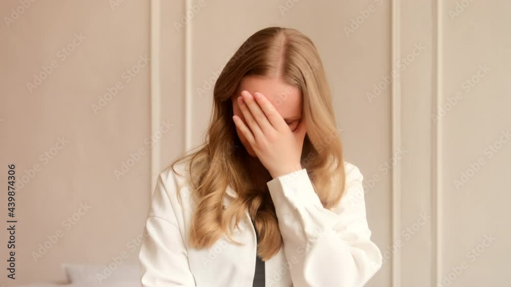 Young upset annoyed woman slapping hand on face doing facepalm disappointment emotion, expressing frustration or shame. Young upset annoyed woman slapping hand on face doing facepalm disappointment emotion, expressing frustration or shame.