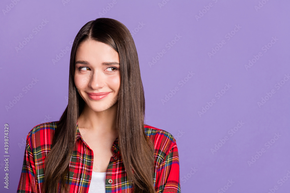 Photo of lovely brunette hairdo young lady look empty space wear red shirt isolated on purple color background