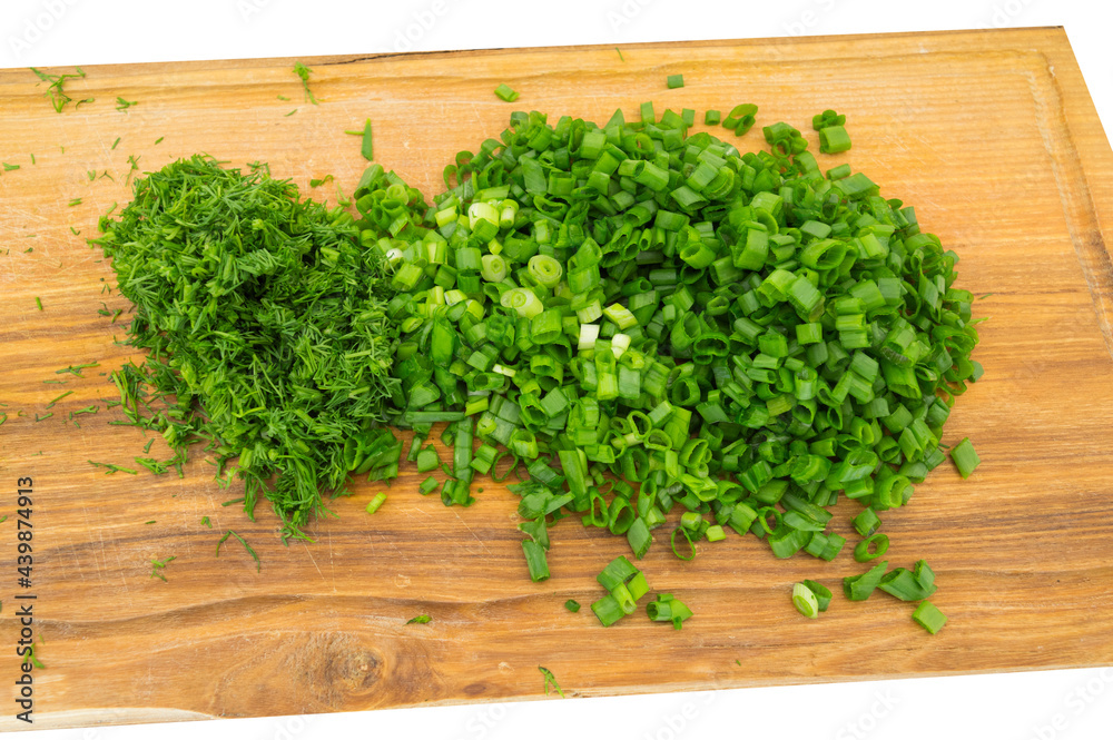Parsley and young onion sliced and stands on board Parsley and young onion sliced and stands on board