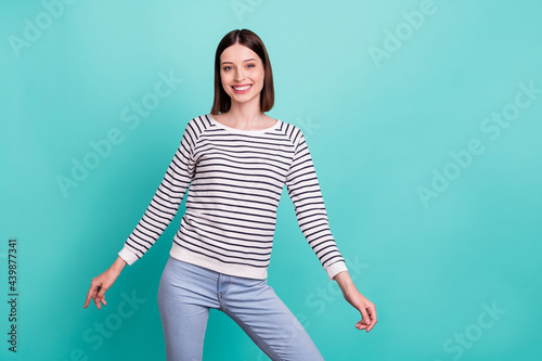 Photo of carefree positive lady toothy shiny smile posing wear striped shirt isolated on teal background