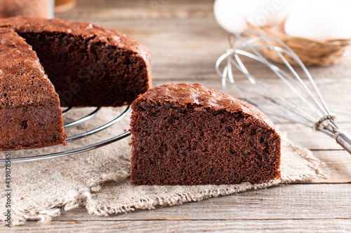 Photo of delicious chocolate sponge cake on table photo