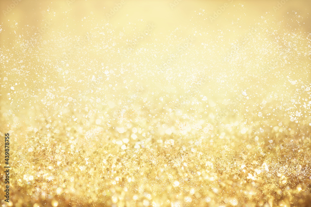 Gold light Festive Christmas background. Abstract twinkled bright background with bokeh defocused golden lights