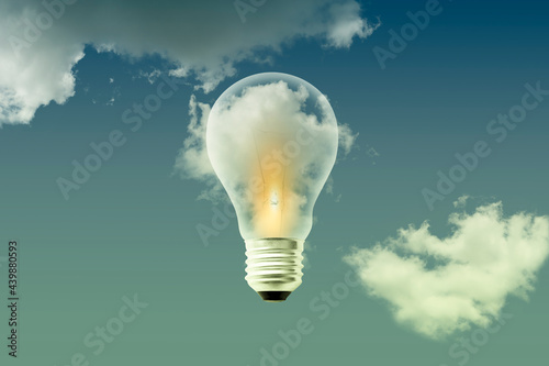 Light bulbs white bright warm light on cloud sky background - Idea thinking and creative concept background