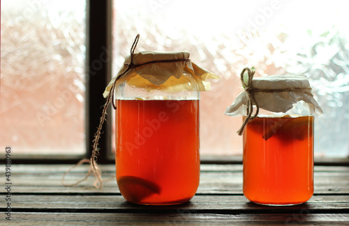 Homemade kombucha with peach and orange.  Recipe cooking kombucha. Fermented beverages. Copy space.
