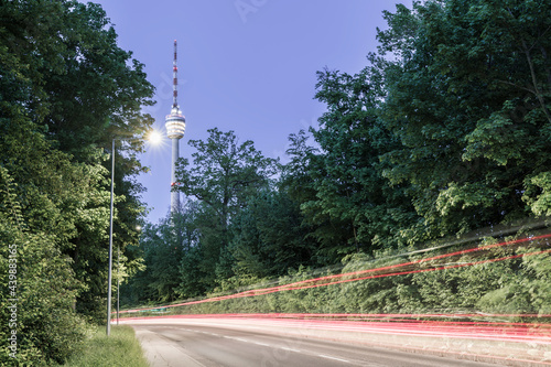 Germany, Illuminated skyline of stuttgart city and cityscape at hight traffic street and television tower fernsehturm in magical night atmosphere retro look photo