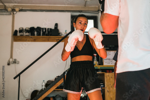 Female Kickboxing Athlete During Sparring