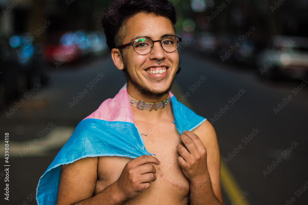 Happy gen z trans boy with pink and blue flag Stock Photo | Adobe Stock