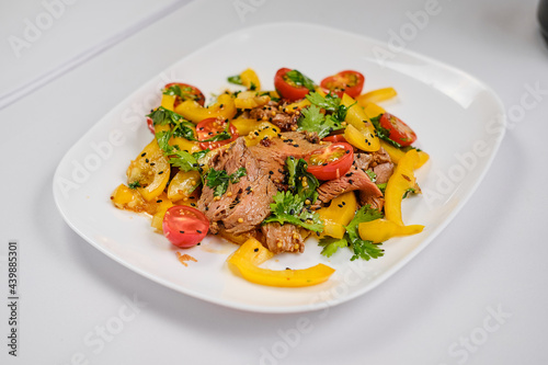 fresh salad with mozzarella, meat , ruccola and tomatoes