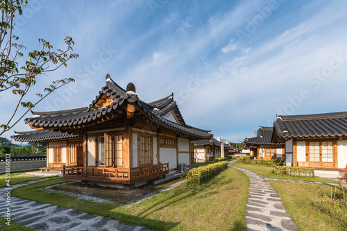 Architecture traditional oriental wooden house with blue sky on sunny day at Ojuk Hanok Village photo