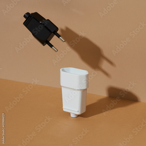 black and white male and female electrical plugs photo