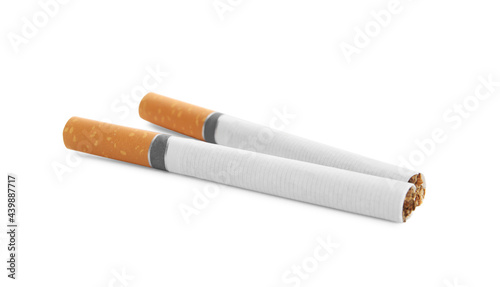 Cigarettes with orange filters isolated on white