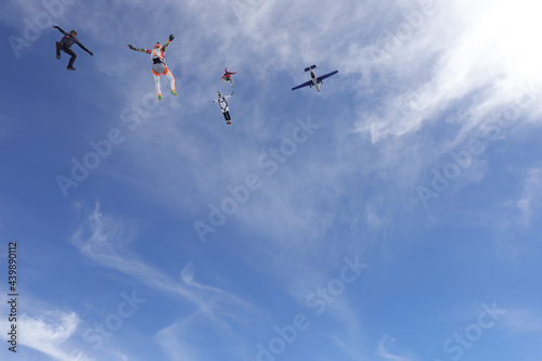 Skydiving. SKydivers are having fun in the blue sky.