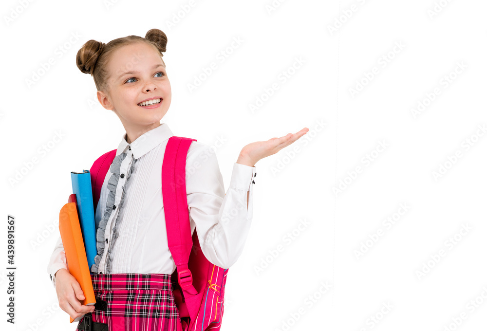 Happy cute smiling cheerful child girl in school uniform holding books. Concept of education, reading, back to school