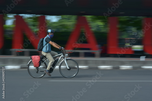 person riding a bicycle in road