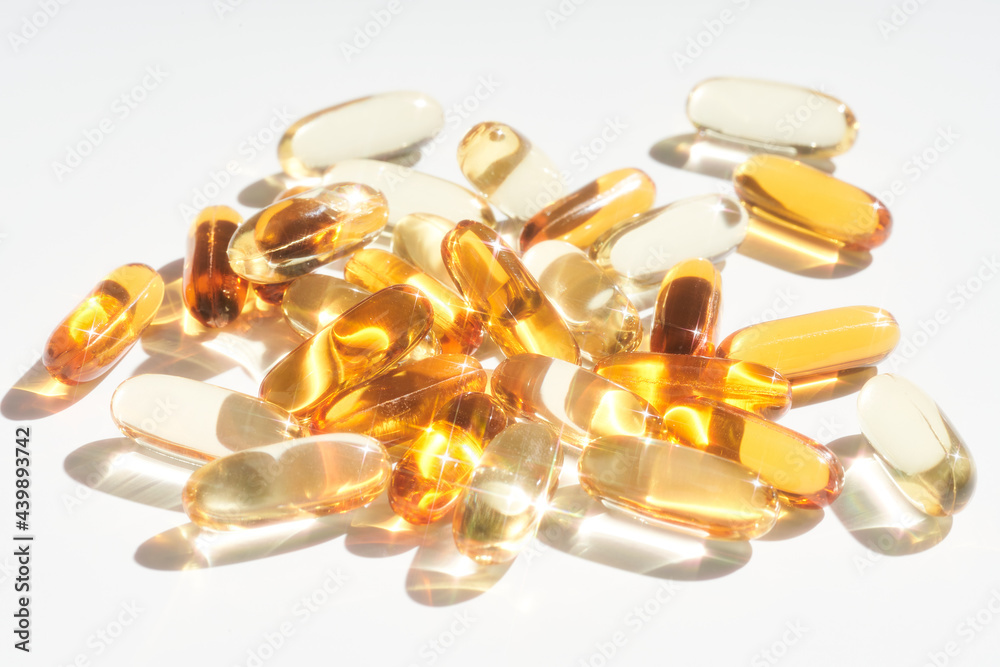 Heap of oil capsules on table Heap of oil capsules on table