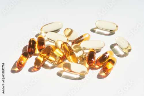 Pile of vitamin capsules on table photo