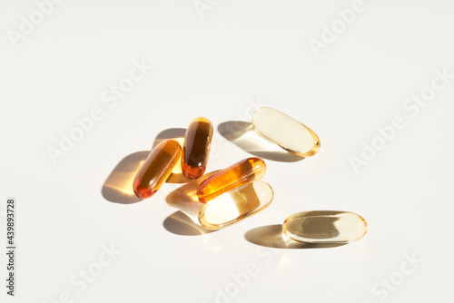 Various supplement capsules on table photo