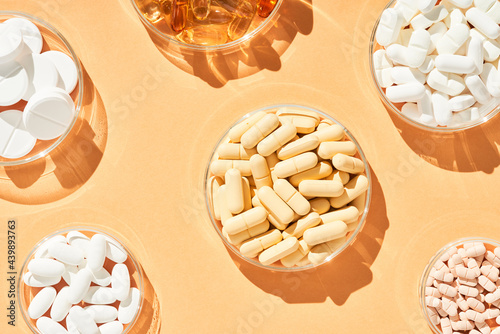 Layout of bowls with various drugs on table photo