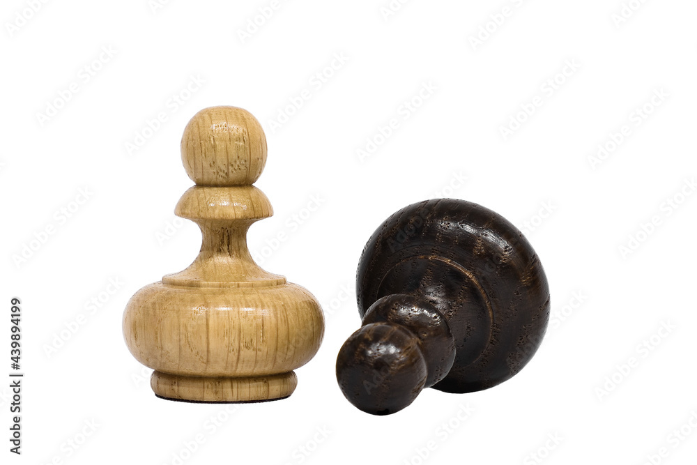 Chess pieces isolated on white background. White chess pawn stands over the lying black pawn. Victory and defeat concept. Chess pieces isolated on white background. White chess pawn stands over the lying black pawn. Victory and defeat concept.