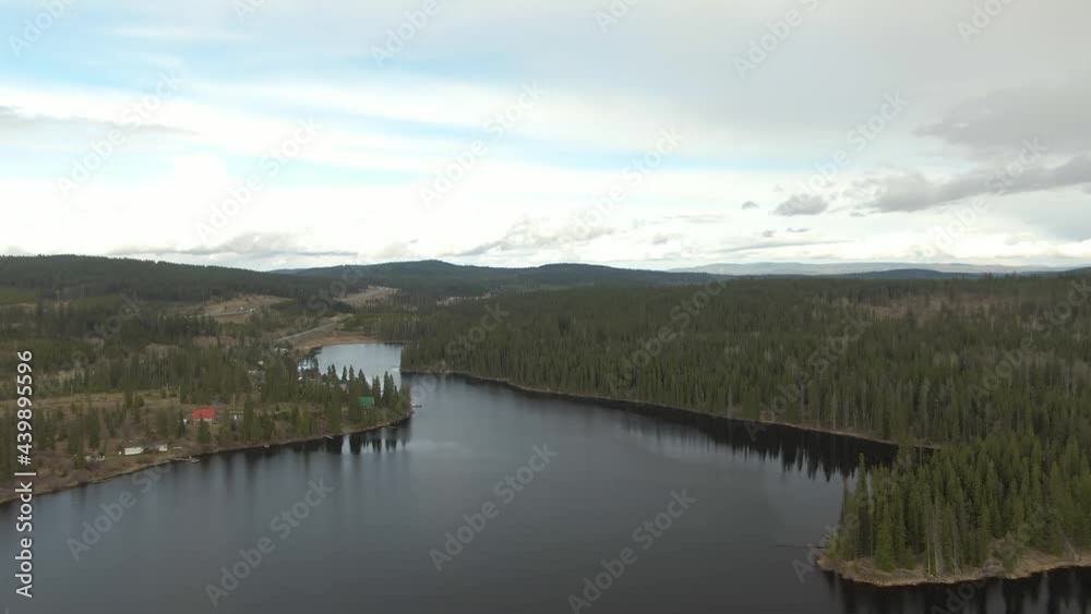 Aerial View of a Lake in the Canadian Landscape. Cloudy and Sunny Spring Day. Taken near Kamloops and Merritt, British Columbia, Canada. Aerial View of a Lake in the Canadian Landscape. Cloudy and Sunny Spring Day. Taken near Kamloops and Merritt, British Columbia, Canada.