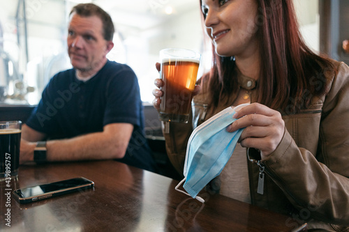 Brewery: Woman Removes Face Mask To Have A Beer