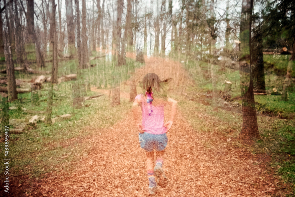 Double Exposure of child running in woods Double Exposure of child running in woods