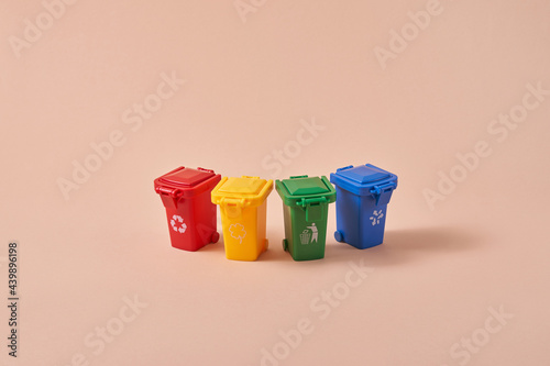 Small colored rubbish bins for recycling photo