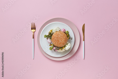 Burger with flowers on plates photo