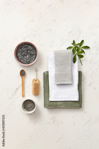 Black wet clay and towels for spa photo