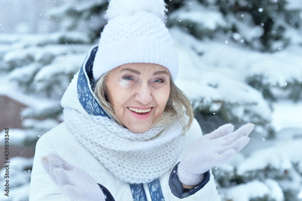 Happy beautiful senior woman in warm hat Happy beautiful senior woman in warm hat