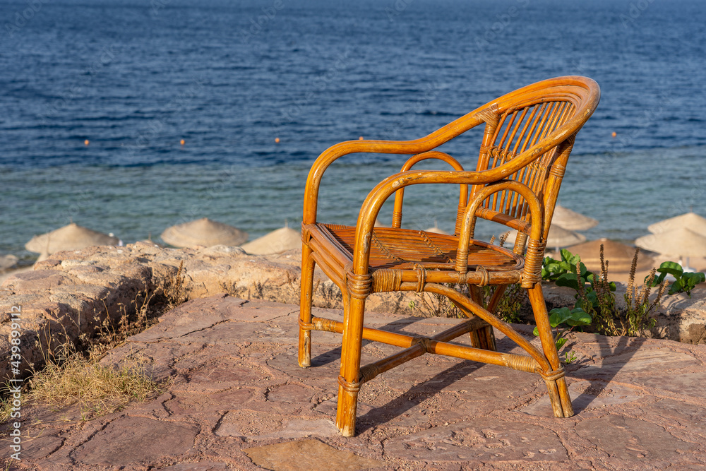 Rattan chair on the tropical beach near the sea in Sharm El Sheikh, Egypt