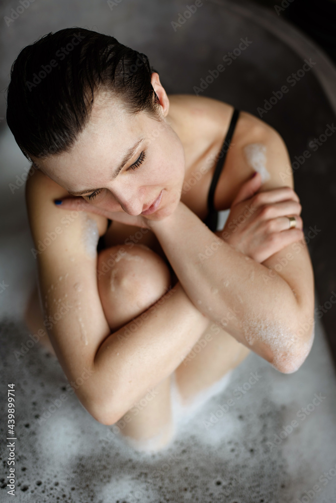 Portrait of a woman taking a bath