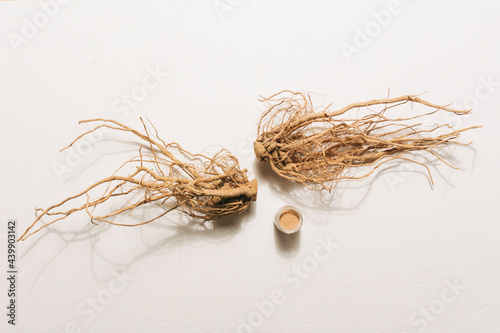 Ashwagandha roots with powder photo