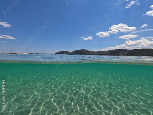 Sea level and underwater photo of Agia Marina beach in Attica, Greece