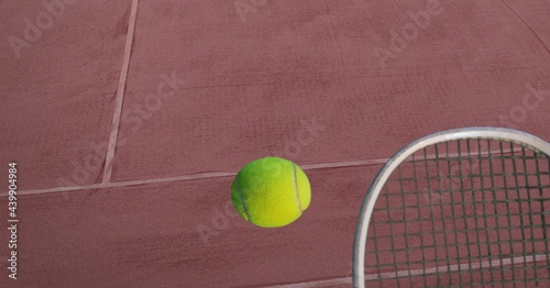 Composition of tennis ball and racket on tennis court © vectorfusionart