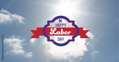 Happy labor day text and tool icons against clouds in blue sky