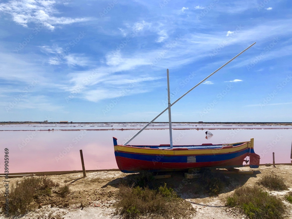 fishing boat on the pink saline