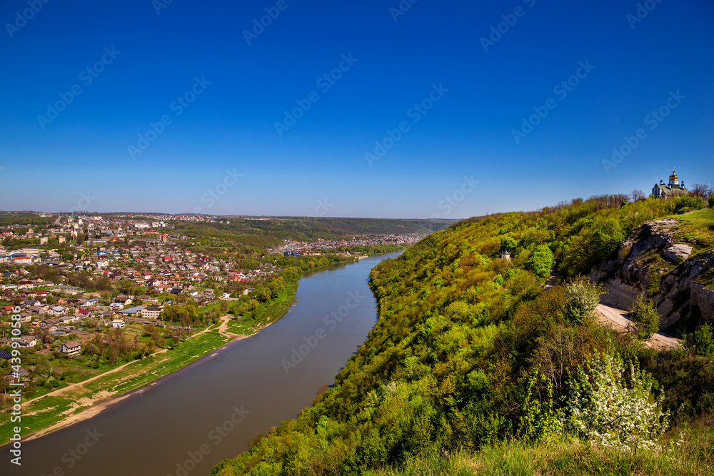 Beautiful view of the canyon with the river Dniester and the city in summer. Zalischyky