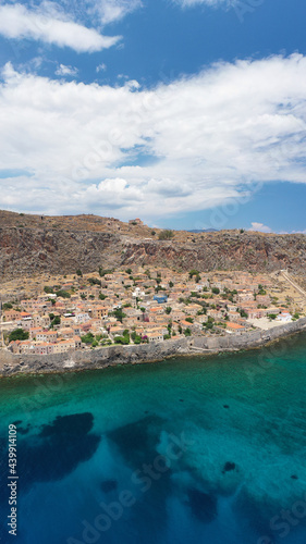 Fototapeta Naklejka Na Ścianę i Meble -  Aerial drone photo of beautiful castle and medieval old city of Monemvasia in the heart of Lakonia with beautiful clouds and deep blue sky, Peloponnese, Greece
