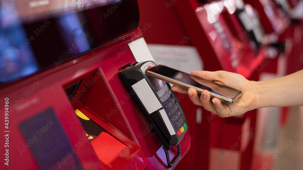 Face Less Machines Faceless caucasian woman pays at selfservice machine with contactless ...