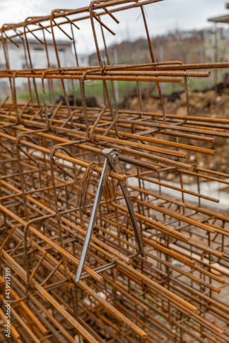 Vertical shot of rusty metal armature frameworks stacked on each other - industry photo