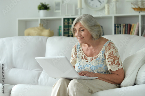 Portrait of beautiful senior woman  with laptop