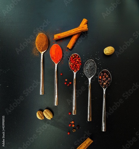 Colorful condiments in five teaspoons
