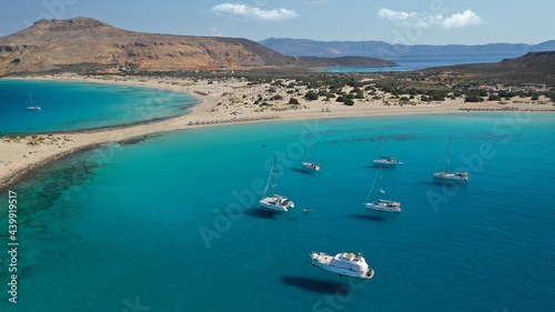 Aerial photo taken by drone of Caribbean tropical exotic island bay with turquoise clear sea sandy beaches resembling a blue lagoon visited by sail boats