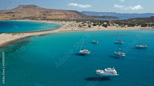 Aerial drone photo of beautiful sandy bay and double turquoise exotic beach of Simos resembling a blue lagoon in small island of Elafonisos, Lakonia, Peloponnese, Greece