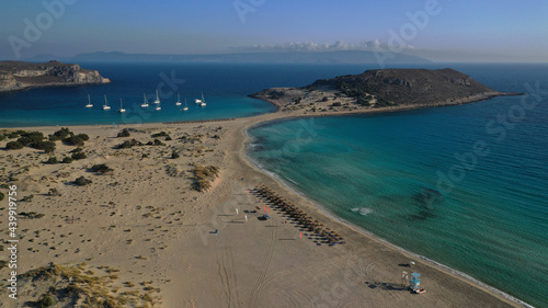 Aerial drone photo of beautiful sandy bay and double turquoise exotic beach of Simos resembling a blue lagoon in small island of Elafonisos, Lakonia, Peloponnese, Greece