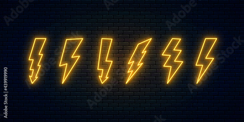 Neon lightning bolt set. Electric discharge neon symbols collection. Thunder and electricity sign. Banner design, bright advertising signboard elements. Vector illustration. High-voltage thunderbolt