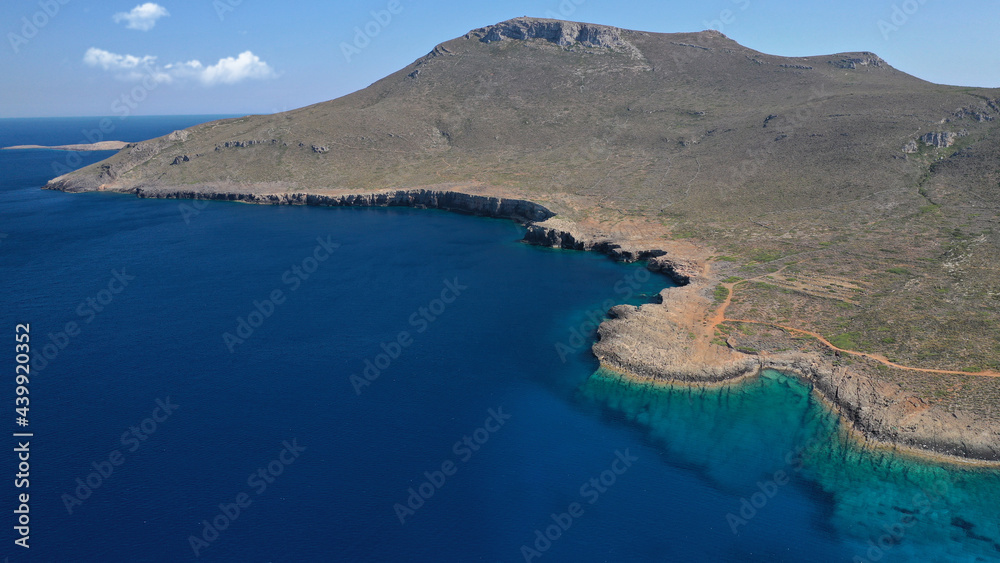 Fototapeta premium Aerial drone photo of main port of Kythera island and turquoise exotic beach of Diakofti, Ionian, Greece