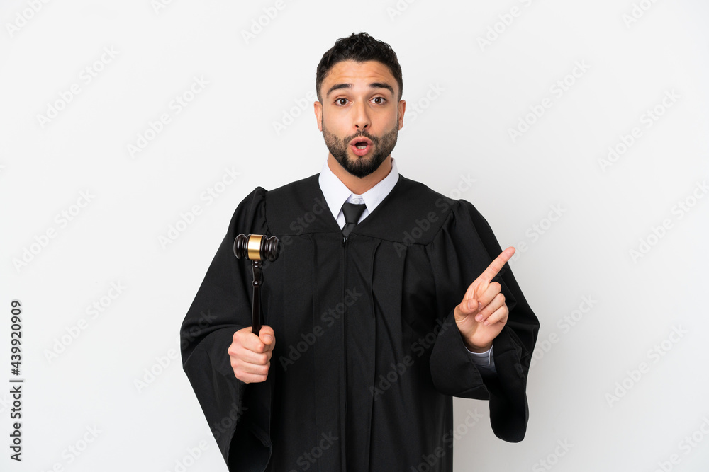 Judge arab man isolated on white background intending to realizes the solution while lifting a finger up Judge arab man isolated on white background intending to realizes the solution while lifting a finger up